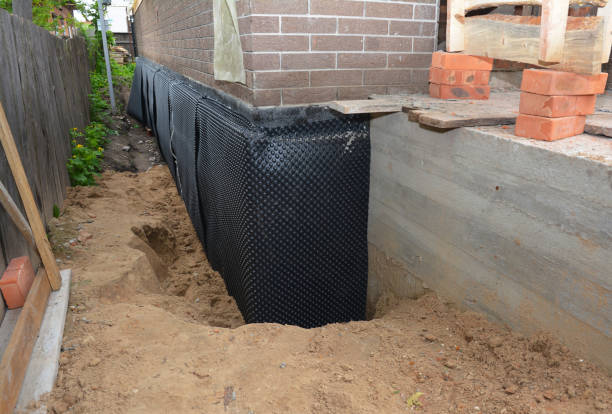 SJ Waterproofing Pros technician performing targeted Vapor Barrier Installation assessment in Gresham, WI